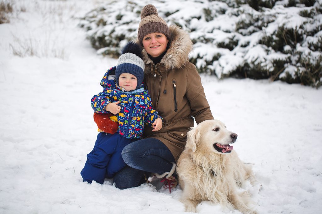 Mother son and dog in snow